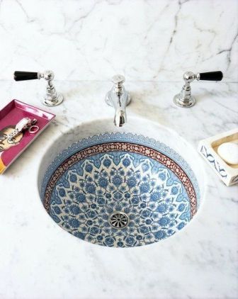 I fell in love with tiled sinks on our trip to Spain. Our villa in Altea's hills had a gorgeous deep blue and white sink, with mosaics. Found on apartmenttherapy.com