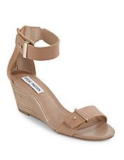 My go-to shoe. A wedge with toe and ankle strap. I have this shoe, and have had this shoe, in so many variations. There's a reason: with jeans and a pretty top, this shoe adds height without sacrificing walk-ability, and with a skirt these babies make your calves look toned - all while allowing you to move without the fear of catching your heel in a grate (or location specific pitfall). 