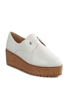 Shellys of London has it going on with this white patent flatform. Long, long legs with a boyish twist, perfect with culottes, skirts or cropped trousers. And the cork bottom is soft on your feet for a day full of walking.