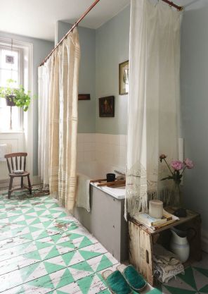 Beautiful drapes as shower curtains and a painted floor - imperfectly perfect. Found on introducingnewworlds.blogspot.com