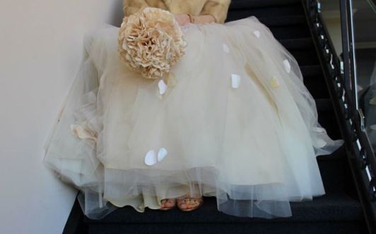 My tulle-skirted, one shoulder gown, in blush, with a paper bouquet and Granny's vintage fur.