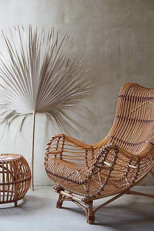 Styled to perfection. Who wouldn't want to recline in a Susila Rattan Chair for  $998.00 (Anthro)