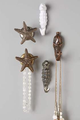 Sea shell knobs and hooks. Found on Anthropologie.com