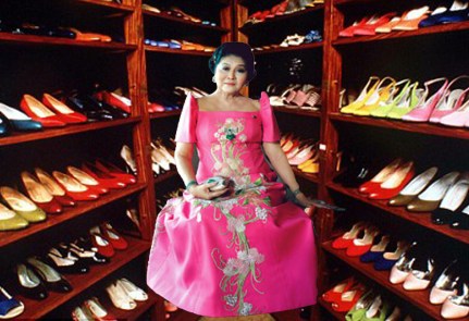 Imelda Marcos, amongst her shoe collection; impressive for a first lady of a country that was bankrupt. 
