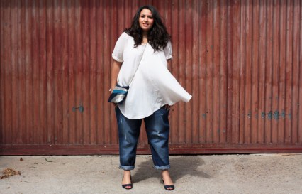 You should buy clothes for the body you HAVE. Dress with pride and you'll feel better (most of the time). There are so many options, but we limit ourselves by attaching our sense of what will look great on us when we stay in a size (number or letter) that we 'want' to wear. When I shop, I go through the racks and look at things that by body fits into. I can always belt, hem or alter things. I might have missed some AMAZING finds if I was obsessed with the number on the tag. I'd rather feel great in a L-XL and get a great fit that squeeze myself into a size, or buy something just because it has a small tag size. Sizes vary by store, so you're likely to be a different size in a variety of brands. Who, other than you, is looking at your tags, anyway?